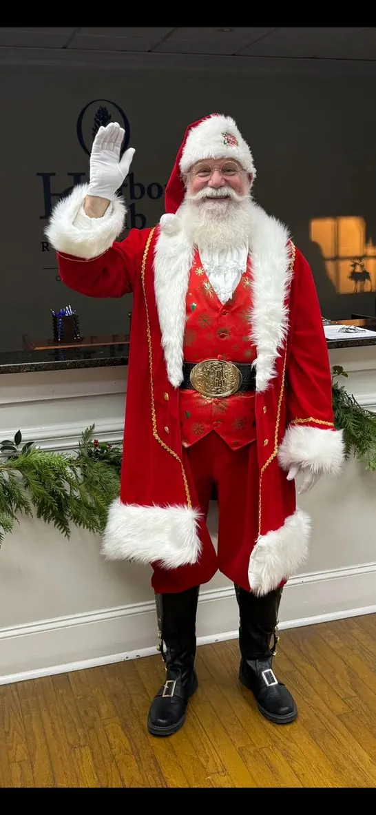 Santa Don in full red suit waving, with his real white beard